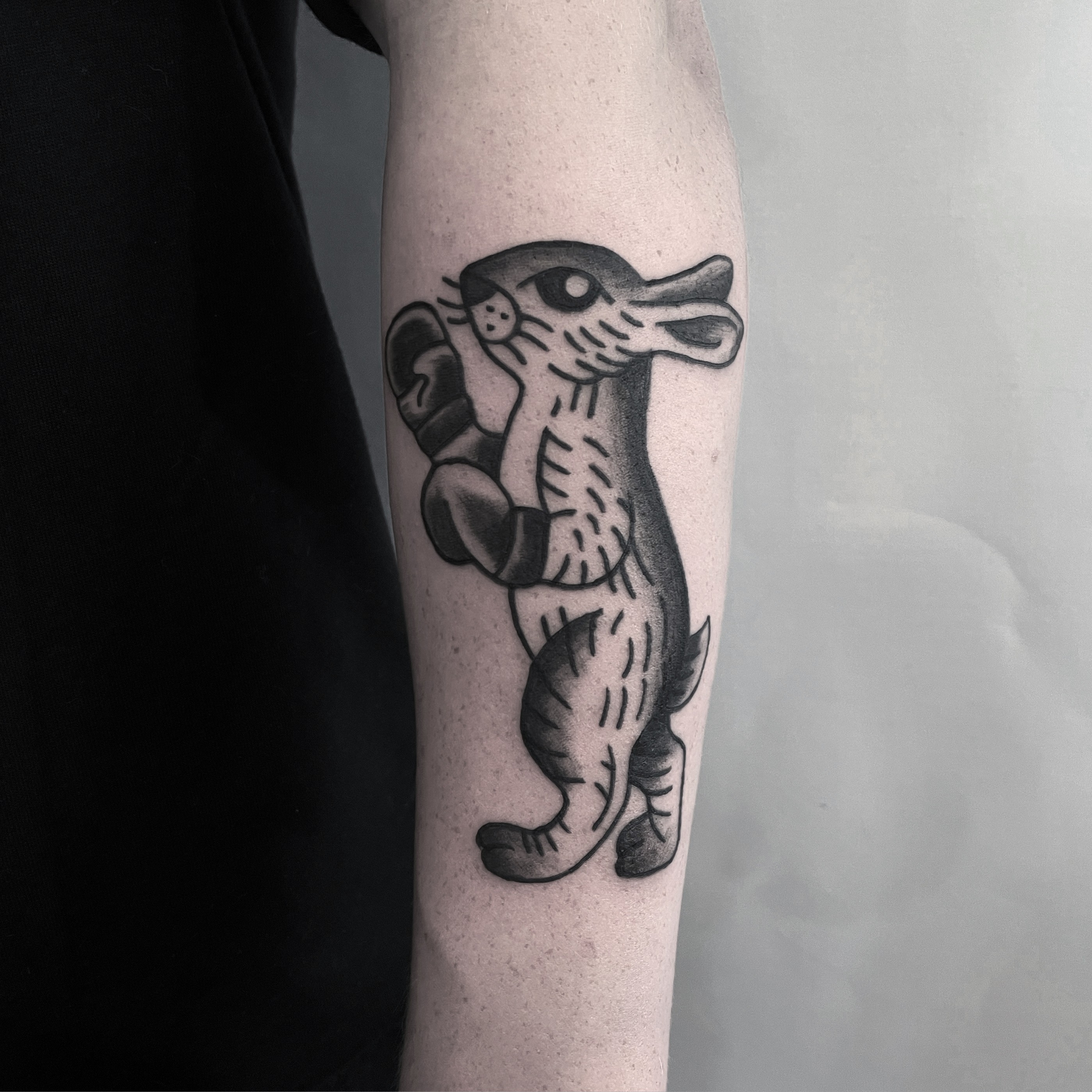 Rabitt boxer tattoo in bold illustrative blackwork style